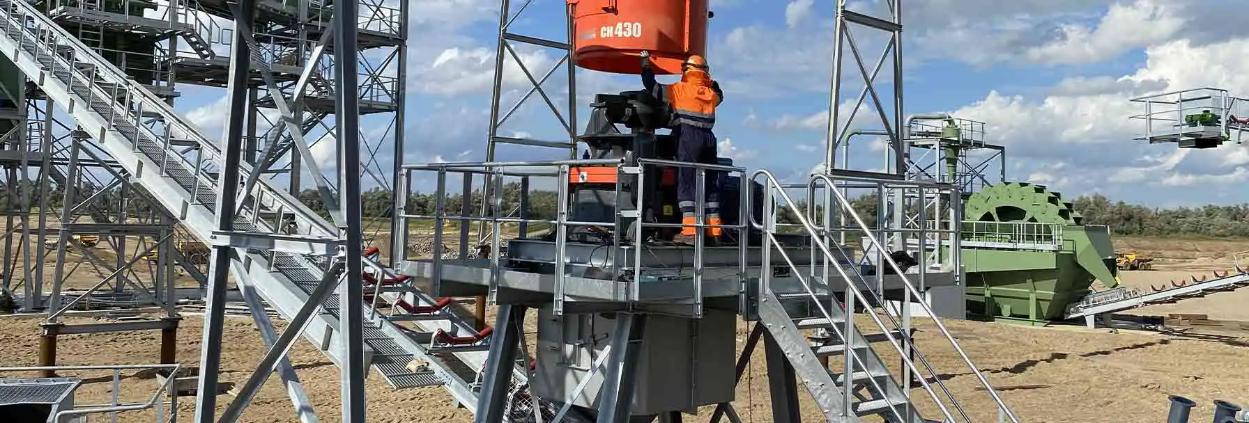 Lutze technician working on a Sandvik CH430 crusher