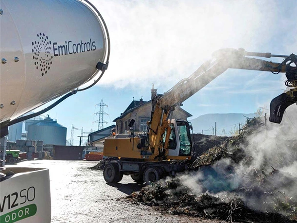 Dust suppression in a waste handling environment with odor neutralizer