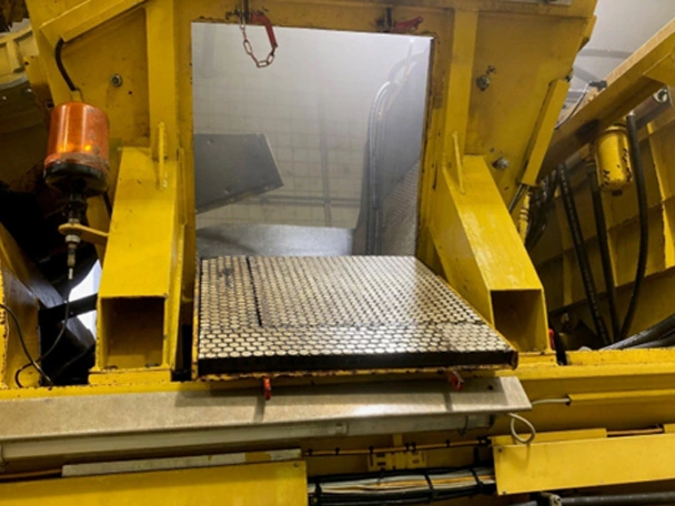 Ceramic lining at material transfer point on railway machine