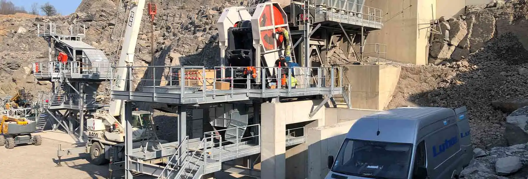 Comprehensive Service and Support Lutze technicians performing crusher maintenance at a customer site