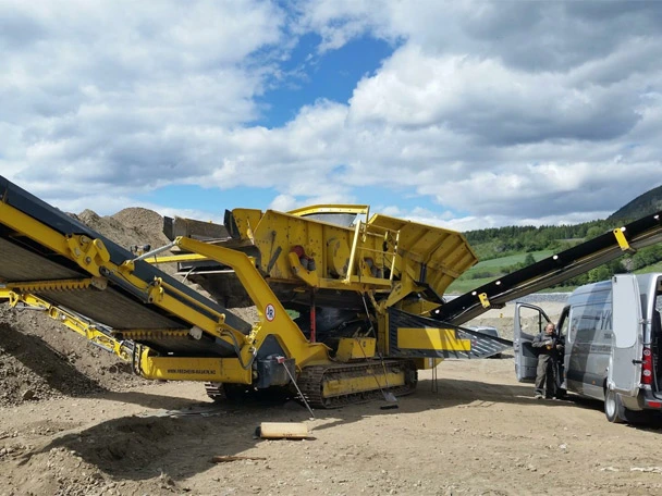 Technician next to mobile screening machine in Norway
